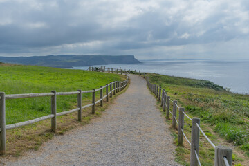 Fototapeta na wymiar way to the immensity of the sea in the cape of Ajo, in Cantabria