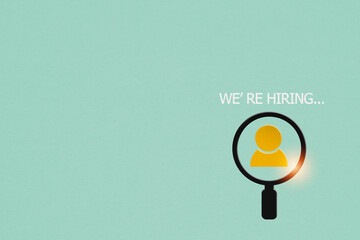 we are hiring background, job vacancy concept, paper cut of man and magnifying icon with text on grunge green background including copy space