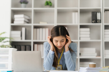 Asian businesswoman in formal suit in office happy and cheerful during using smartphone and working