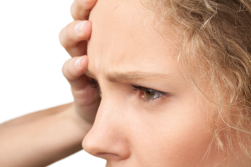Young woman with headache isolated on white background