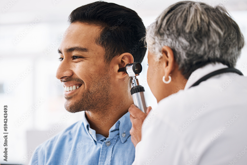 Wall mural Doctor check patient ear, healthcare and medical consultation at hospital with otolaryngology specialist. Happy man and physician woman with otoscope, test for hearing problem and health insurance