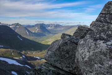 View from Manaraga peak in Nether-Polar Ural mountains, Russia at sunny summer day. Rocks on foreground