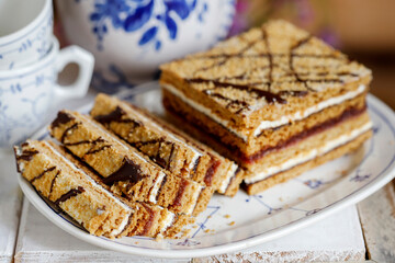 Homemade honey layer cake on the table.