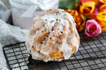 Traditional easter cake and bouquet of tulips in the background
