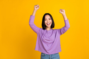 Photo of young korean woman scream wear trendy violet shirt fists up hooray celebrate shopping season isolated on yellow color background - obrazy, fototapety, plakaty