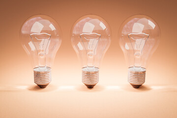 three retro style lightbulbs with glowing filament standing in a row on infinite colorful background; creativity design concept; 3D Illustration