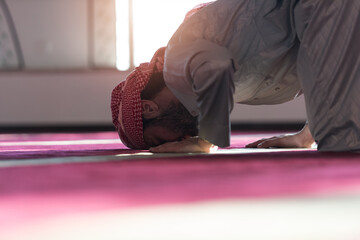 Arabic Muslim Man Making Traditional Prayer To God While Wearing traditonal arabic clothes during ramadan