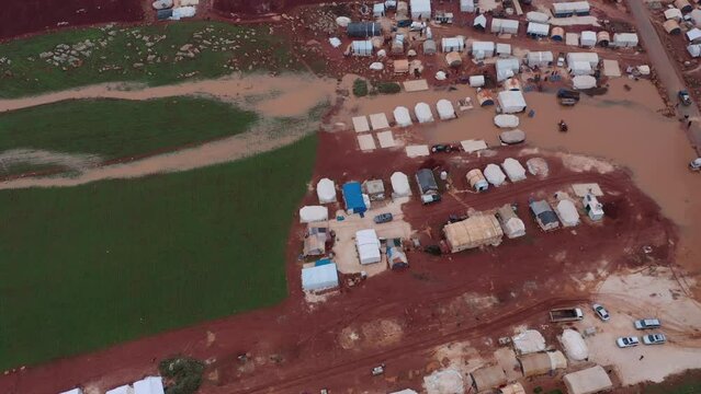 Top view of a Syrian refugee camp. Syrian refugee tents flooded due to heavy rains.
