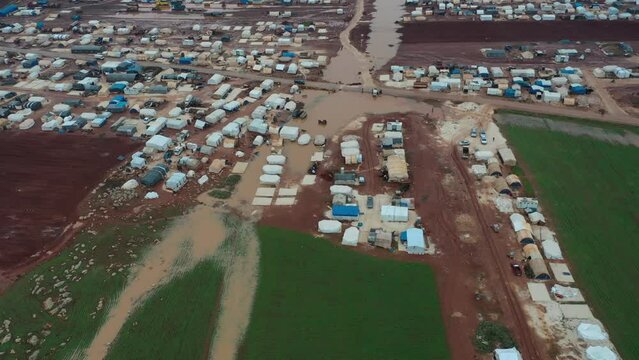 Top view of a Syrian refugee camp. Syrian refugee tents flooded due to heavy rains.