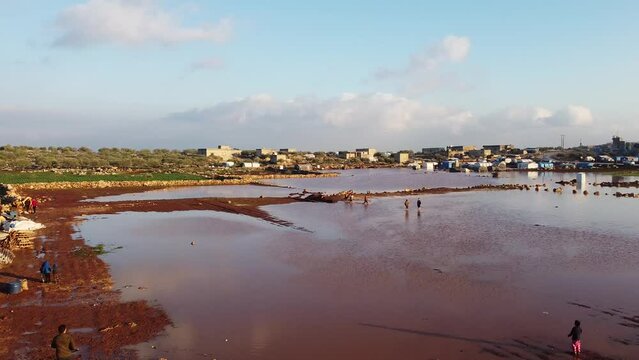 Top view of a Syrian refugee camp. Syrian refugee tents flooded due to heavy rains.