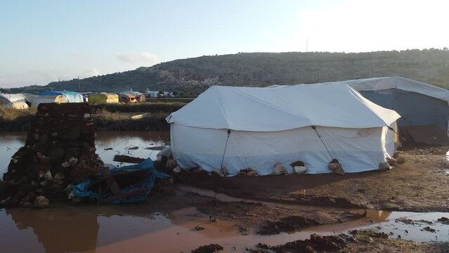 Top view of a Syrian refugee camp. Syrian refugee tents flooded due to heavy rains.