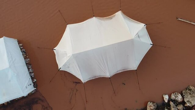 Top view of a Syrian refugee camp. Syrian refugee tents flooded due to heavy rains.