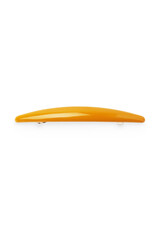 Detailed shot of a mustard colored oval hair clip. The hairpin is isolated on the white background. Vogue accessory for ladies and girls.