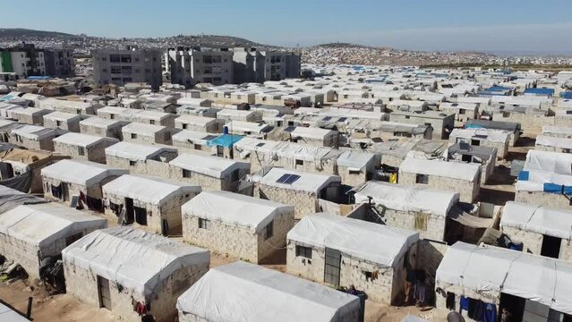 Drone shot of hundreds of tents inhabited by Syrian refugees for years due to the war that destroyed their homes.