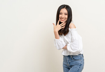 Beautiful smiling happy young asian woman age around 25 in white shirt. Charming female lady...