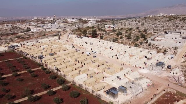 Drone shot of hundreds of tents inhabited by Syrian refugees for years due to the war that destroyed their homes.