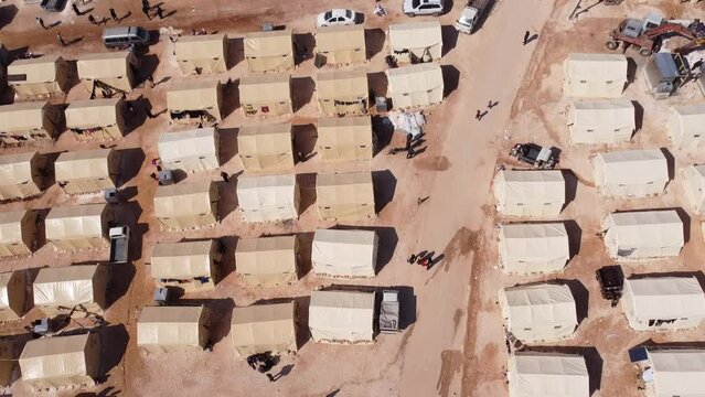 Drone shot of hundreds of tents inhabited by Syrian refugees for years due to the war that destroyed their homes.