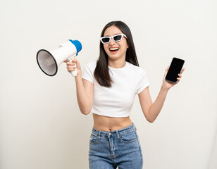 Shout out loud with megaphone. Young beautiful asian woman  announces with a voice about promotions...