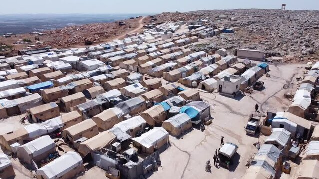 Drone shot of hundreds of tents inhabited by Syrian refugees for years due to the war that destroyed their homes.