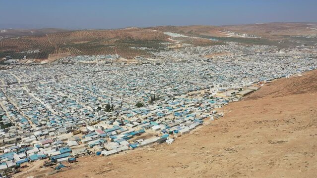Drone shot of hundreds of tents inhabited by Syrian refugees for years due to the war that destroyed their homes.