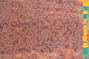 Rusted steel plate. Abandoned house, ruins. Metal. Background material. Stone, rock, etc…