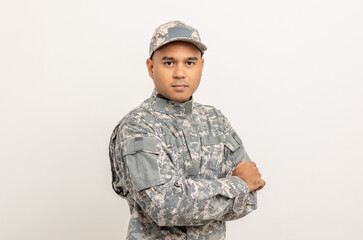 Asian man special forces soldier standing with arms crossed against on the field Mission. Commander...