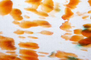 Orange and white abstract hand painted tie dye texture