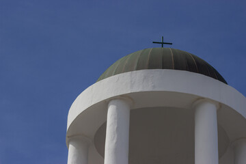 white top columns church with skyview