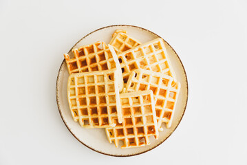 Belgian waffles on white table. top view