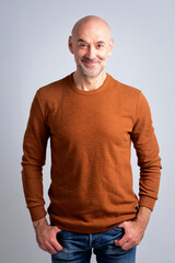 Portrait of a confident mature man with bald head against isolated background - 594278827