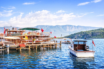 Pleasure boats for tourists at the Chamlik pier on the way to the island of Cleopatra, Aegean Sea, Marmaris, Turkey