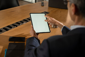 Close up of man using digital tablet