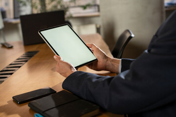 Close up of man using digital tablet