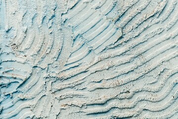 Closeup of pastel blue wall with abstract concrete textures, perfect for wallpapers