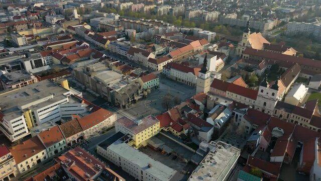 Aerial footage of the streets of Trnava with many bell towers, Slovakia, 4k