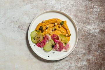 Hummus with pumpkin and radish