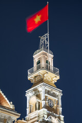 Traffic in front of Ho Chi Minh City Hall, Saigon City Hall or Committee Head office in the evening, Vietnam. Light trail and night. Popular place to visit in Saigon. Travel destinations in Vietnam