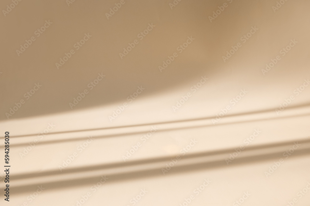 Poster Abstract pastel beige wall background with shadows of window. Empty studio for product presentation. Display product with blurred backdrop.