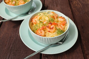 A plate of delicious shrimp alfredo with garlic and cream sauce over pasta