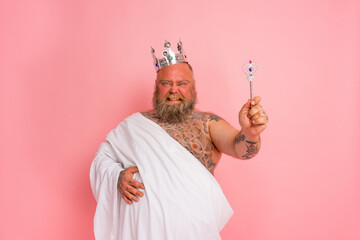 Crazy fat man act like a king with a magic wand