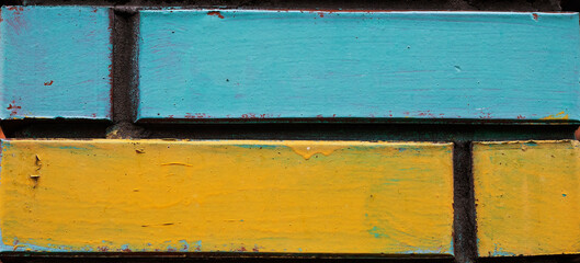 Ukraine flag painted on a brick wall. war in Ukraine