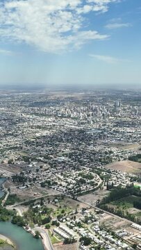 Aerial view of city located next to a river on a sunny summer day. Neuquen, Patagonia Argentin