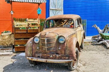 Abakan, Russia 04.19.2023: Skeleton driving an old, rusty car