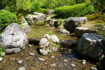A small waterfall on a small man-made river passing through Kenroku-en