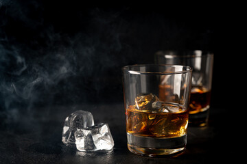 Whiskey with ice in glasses