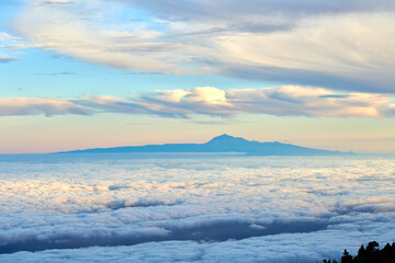 Tenerife is the largest of Spains Canary Islands, off West Africa. Its dominated by Mt. Teide, a dormant volcano that is Spains tallest peak. Tenerife may be best known for its Carnaval de Santa Cruz