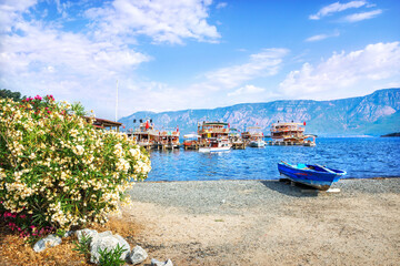 Naklejka na ściany i meble Pleasure boats for tourists at the Chamlik pier on the way to the island of Cleopatra, Aegean Sea, Marmaris, Turkey