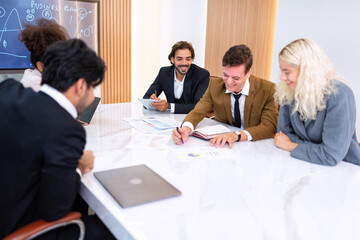 Employee on job corporate Business colleagues sit around table work as team and hand gathering
