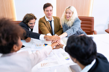 Employee on job corporate Business colleagues sit around table work as team and hand gathering