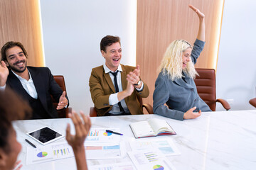 Employee on job corporate Business colleagues sit around table work as team and hand gathering